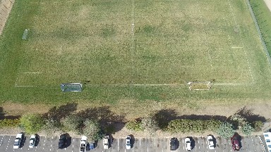 an aerial view of a soccer field and parking lot COLORADO