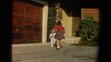 1958: children playing outside from their house. CALIFORNIA