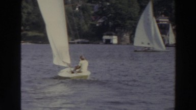 1966: Sailboats Racing on a Lake Near Shoreline in Madison Wisconsin