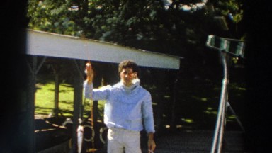 1966: A Young Man Showing His Fishing Catch on a Sunny Day in Madison Wisconsin