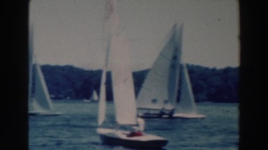 1964: multiple sailboats floating on a lake. TUSTIN WISCONSIN