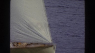 1966: view of a sailboat on the water in summer with passengers and good wind
