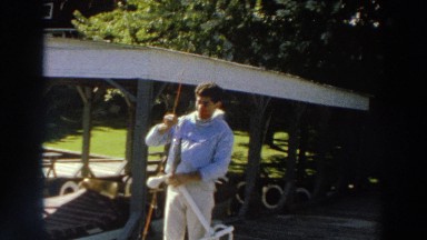 1966: man holding a fish that he just caught. MADISON WISCONSIN