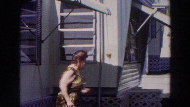 1966: woman talking right outside her mobile home. PUERTO RICO