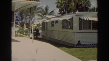 1966: man walking alongside his mobile home. PUERTO RICO