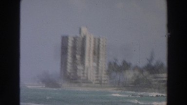 1966: tall skyscrapers overlook the ocean on a foggy day WISCONSIN