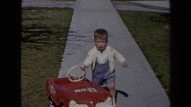 1958: child pushes red car LAS VEGAS