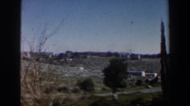 1960: A Barren Hilly Landscape and a Car Driving into a Parking Lot in Israel