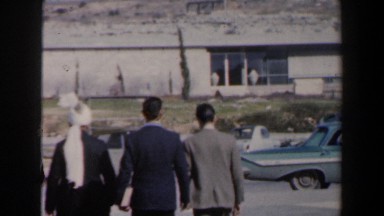 1960: random people walking through the parking lot. ISRAEL