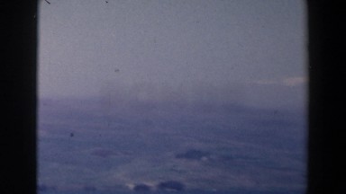 1960: quick view of a landscape showing a large body of water with buildings