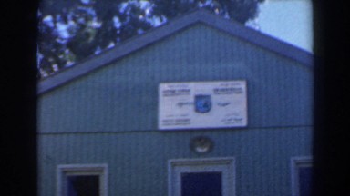 1960: building with a sign on the front of it with vegetation behind it ISRAEL