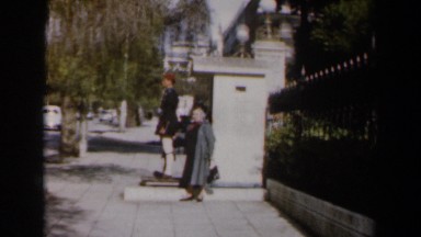 1960: two people waiting for a bus at daytime ISRAEL