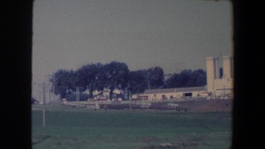 1959: Two Supervisors Surveying Silos at a Massive Farming Complex in Iowa