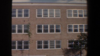 1960: a magnificent building with many floors and windows on street side