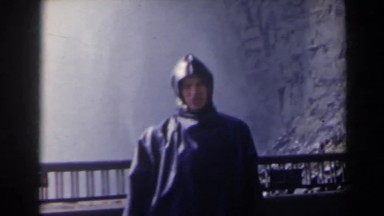 1963: Person in Raincoat Near Waterfall Niagara Falls