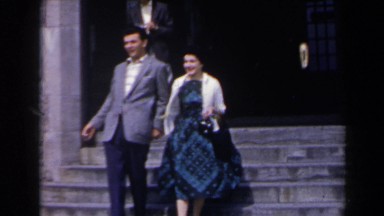 1963: Woman Walking Down Steps Waving at Camera, Niagara Falls
