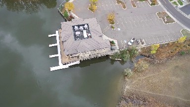 aerial view of building with a boat dock. COLORADO