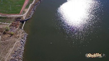 Aerial Footage of a Jetty Lined with Rocks Next to a Golf Course Colorado