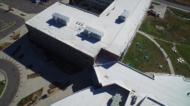 a diagram of a building with a parking lot that is full with different color