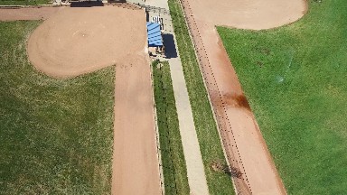 aerial view of a well maintained sports area including sections of where to sit