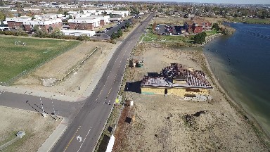view from an airplane of a lake and small town. COLORADO