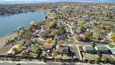 an aerial view of a suburban town near a lake COLORADO