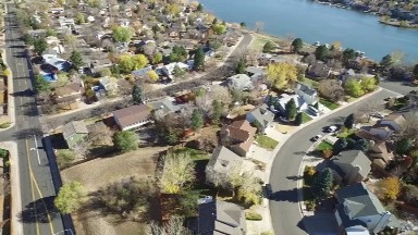 a residential neighborhood near a river, seen from far above COLORADO