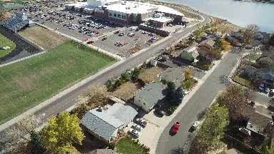 aerial video of a parking lot, buildings, roadways and grassy area COLORADO