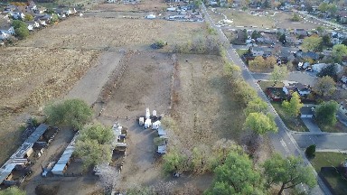 airplane view of a field with a small community off to the side. COLORADO