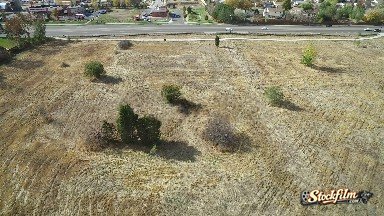 Colorado, United States: An Aerial View of a Field in a Neighborhood Next to a Roadway