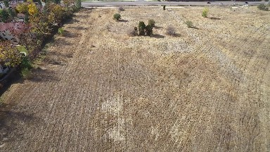 flyover footage of a hay field next to a highway COLORADO