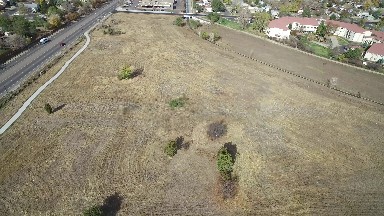 aerial view of lot at edge of town beside the freeway COLORADO