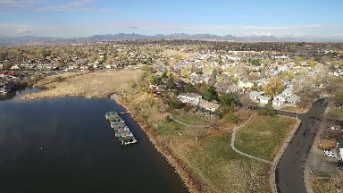 aerial view of a quaint, small town along a shoreline. COLORADO