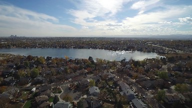 an above view of a neighborhood that surrounds a lake COLORADO