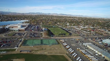 the aerial view of a spectacular playgrounds in the city with vehicles parked