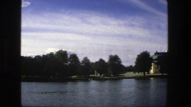 1975: A Line of Trees and Houses Lining a Body of Water, Stockholm Sweden