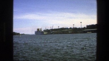 1975: A Boat Sitting in Unsettled Water Near a Pier in Sweden