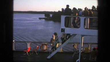 1975: people exiting from a high level on a boat. SWEDEN