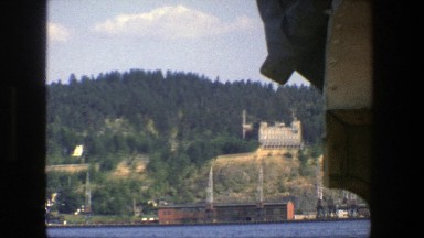 1975: floating down a body of water of view the nearby town