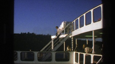 1975: a man walks down the stairs on the deck of a cruise ship SWEDEN