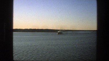 1975: distant boat floating upon the lake. SWEDEN