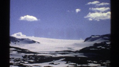 1976: Snowy Mountain on a Sunny and Clear Day with Beautiful Blue Sky Norway