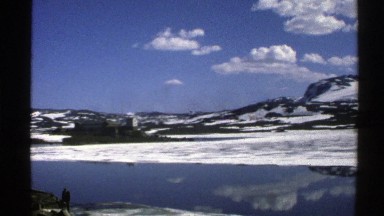 1976: A Beautiful Landscape with Snowy Mountains and Small Lake Norway