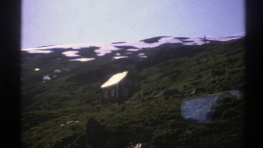 1976: Countryside Mountains with Spanning View of a Little Cottage on the Side