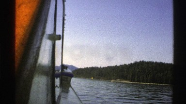 1976: side view of a lake from the middle of a boat. NORWAY