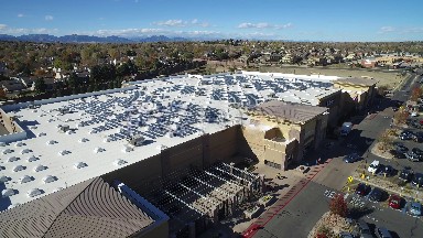 the parking lot of a large department store, seen from above COLORADO