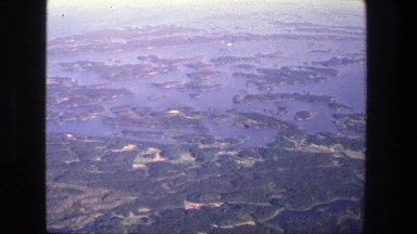1975: a birds eye view of a field and water DENMARK