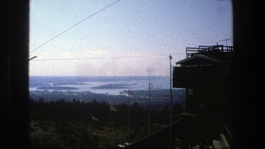 1975: overlooking river and lake from high above on a side of a mountain.
