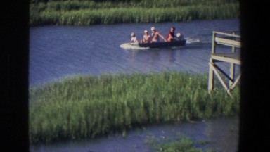1971: a group of people swimming down the river on a motorboat SAINT PAUL