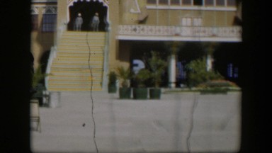 1951: a yellow house with white trim and large curvy windows UTAH